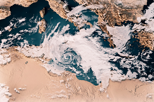 3D Render of a Topographic Map of the Mediterranean Sea with the clouds from February 10, 2023. 
Cyclone Helios near Malta, Sicily and Tunisia.
All source data is in the public domain.
Cloud texture: Global Imagery Browse Services (GIBS) courtesy of NASA, VIIRS data courtesy of NOAA.
https://www.earthdata.nasa.gov/eosdis/science-system-description/eosdis-components/gibs
Color texture: Made with Natural Earth.
http://www.naturalearthdata.com/downloads/10m-raster-data/10m-cross-blend-hypso/
Relief texture: GMTED 2010 data courtesy of USGS. URL of source image:
https://topotools.cr.usgs.gov/gmted_viewer/viewer.htm
Water texture: SRTM Water Body SWDB: https://dds.cr.usgs.gov/srtm/version2_1/SWBD/