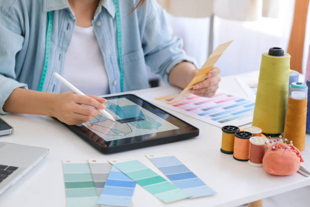 istock Fashion designer working in studio 1487003615