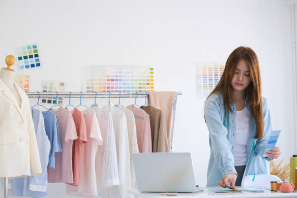 istock Fashion designer working in studio 1487003619