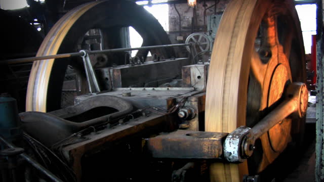 historical  gearing mechanism rotating, detail of steam engine, industrial monument of power production, loop