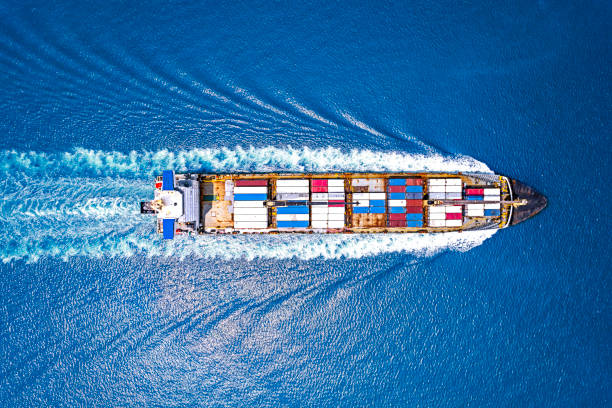 istock Aerial top view container ship full load container for logistics import export, shipping or transportation concept background. 1487004297