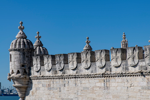 Close up of the battlement of the Belém Tower (Torre de Belém) or Tower of Saint Vincent, a 16th-century fortification and gateway to Lisbon, Portugal along the Tagus River