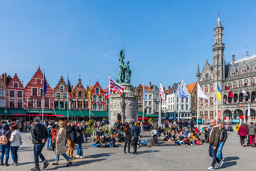 Bruges, Belgium - April 29th, 2023: Big market famous square of Brugge, Flanders.