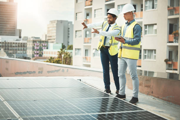 istock Solar panels, engineering and business people with tablet for construction, maintenance and planning. Teamwork, renewable energy and men with digital tech for sustainable photovoltaic electricity 1487016139