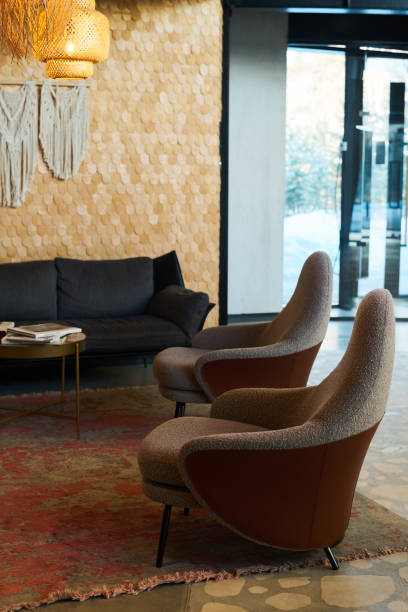istock Part of interior of lounge or openspace office with two comfortable armchairs 1487016354