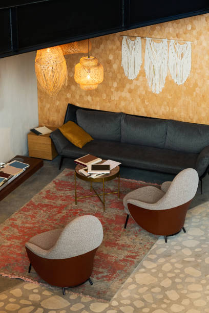 istock Part of comfortable lounge or openspace office with armchairs and couch 1487016563