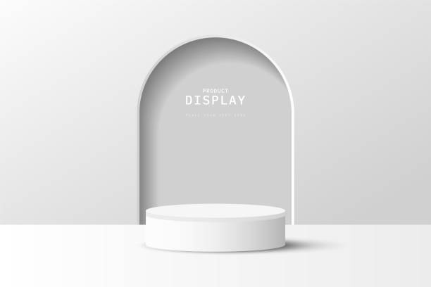 istock studio room rendered 3d white gray cylinder podium pedestal or product display stand with arch door shape background. 3d vector geometric platform. stage for product presentation. 1487016903