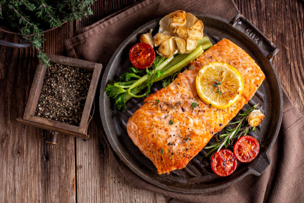 Roasted salmon in iron pan stock photo