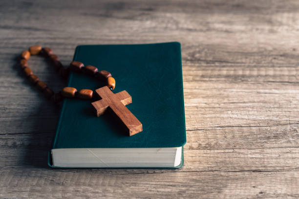 istock Cross and bible on the table 1487018368
