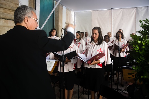 Salvador, Brazil – May 27, 2016: Salvador, Bahia, Brazil - May 26, 2016: Catholics are singing in the church choir for the tribute to corpus christ, in the city of Salvador, Brazil.