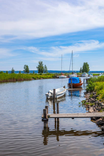 istock Canal with boats at the jetty 1487023588