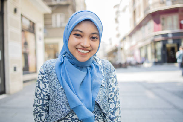 istock Beautiful young woman posing outside 1487024094