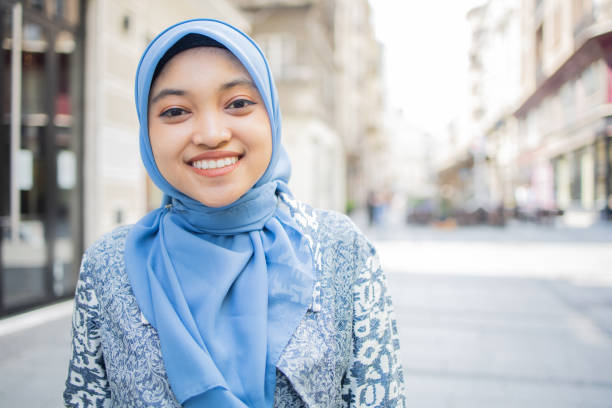 istock Beautiful young woman posing outside 1487024121