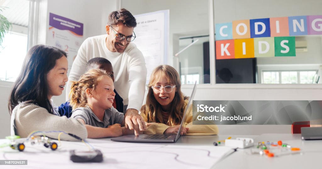 Elementary School Coding Teacher Demonstrates Mechanical Robot