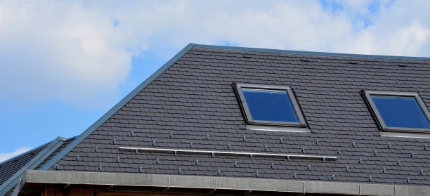 istock construction work on a house made of modern insulating bricks. roof windows, new housing. Windows openings, price of masonry. weekly companies, quality of work, companies, shongle, gray 1487024803