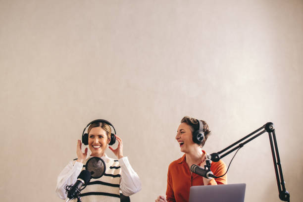 istock Female radio presenters having a good time on a live broadcast 1487025047