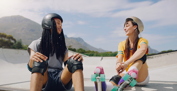 Roller skate, fitness and fun with friends at a skatepark, outdoor during summer for recreation together. Training, exercise or relax with a man and woman skater chilling while bonding outside