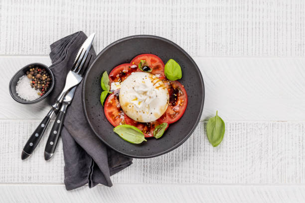 istock Burrata cheese, tomatoes and basil 1487033639