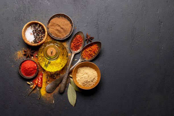 istock Various spices in bowls and spoons on stone table 1487033717