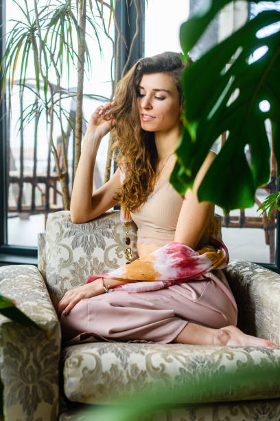 istock Woman sit in cozy home with plants 1487038028