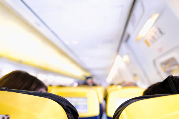 Horizontal picture of Low Cost Airline Cabin with Unrecognizable Passengers