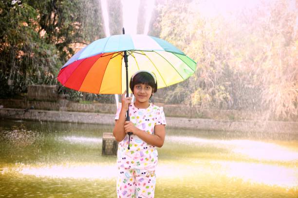 istock Kids enjoying Rainy season 1487041772