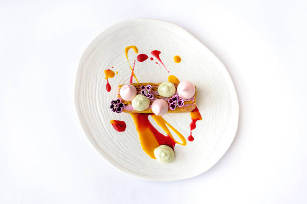 Carrot cake with berry mousse on a white plate isolated