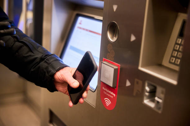 istock Senior man using his smart phone to buy a subway ticket 1487043863