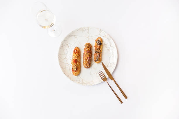 istock Eclairs with various fillings on a gray plate 1487044698