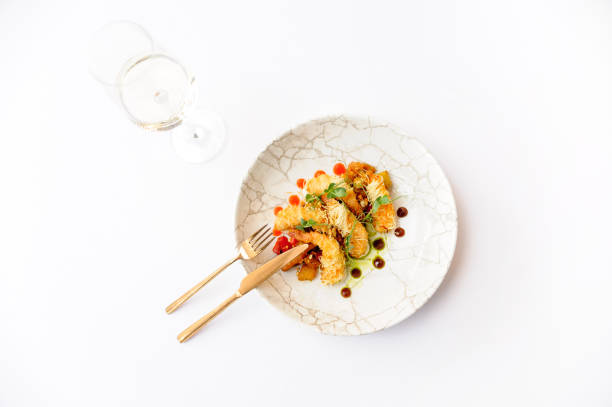 Shrimps in batter on a brown plate isolated