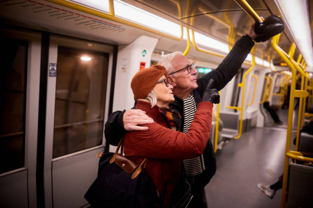 istock Senior couple checking a route map while riding on the subway 1487045511