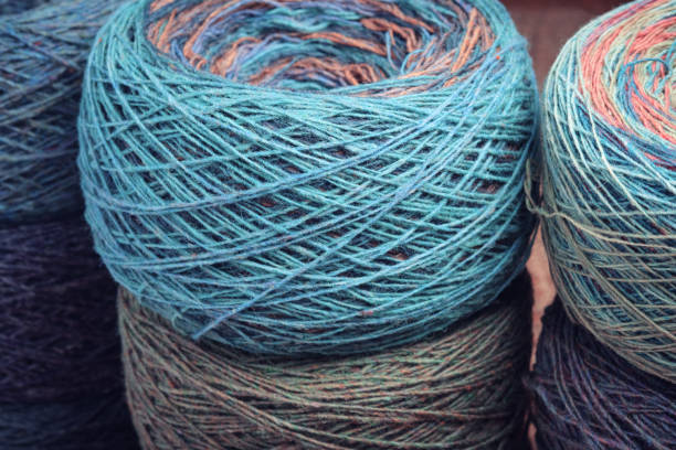 istock Round skeins of organic multi-coloured lambswool yarn. 1487045788