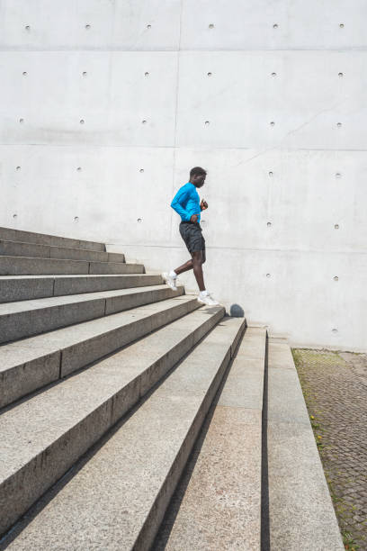 istock young sportsman running down steps outdoors in berlin 1487046501