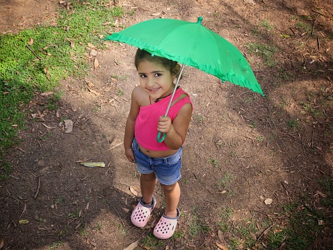 Girl holding umbrella..
