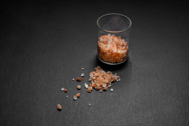 Glass jar with pink Himalayan salt stones in horizontal format