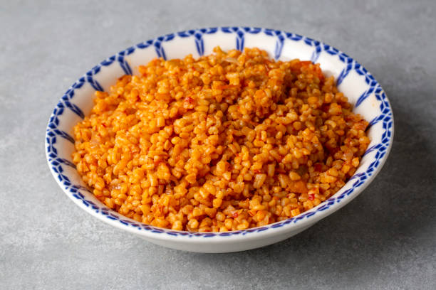 istock Traditional turkish bulgur pilaf with tomato sause in plate (Turkish name; meyhane pilavi or domatesli bulgur pilavi) 1487050552