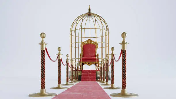 Photo of red carpet with gold barriers leading to throne king inside a golden cage