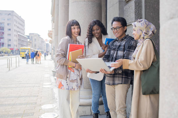 istock Happy young people spending time together outside 1487052753