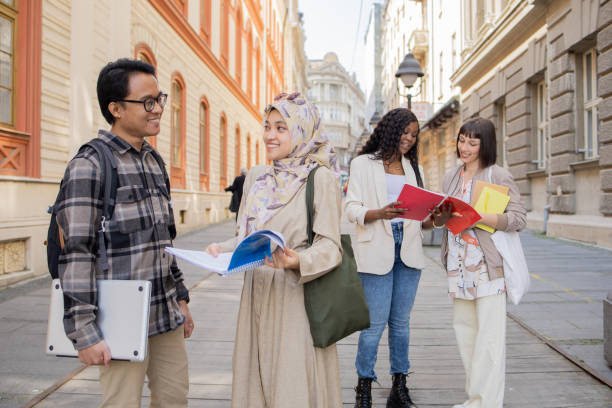 istock Happy young people spending time together outside 1487052839