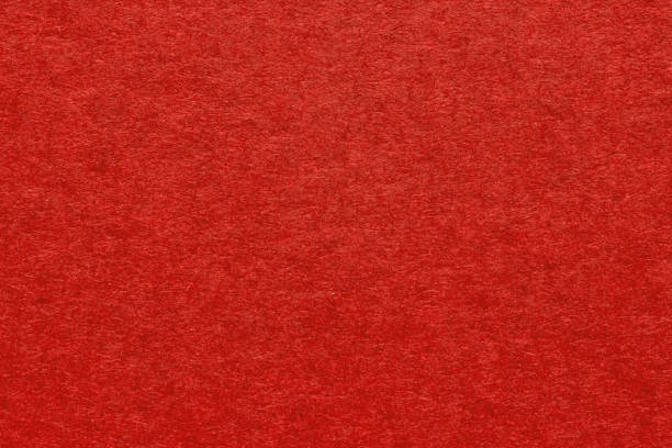 istock Red textured blank paper background close up. Vintage grainy background for design 1487054836