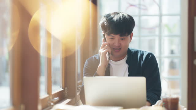 Smart confidence asian startup entrepreneur business owner businessman smile hand use smartphone working in cafe background