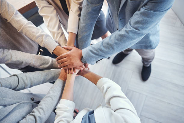 istock Diversity, stack of hands and business people in the office in unity, collaboration and teamwork. Multiracial, corporate and professional team with motivation, support and connection in the workplace 1487057149