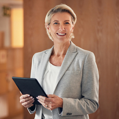 Smile, portrait and senior woman with tablet, happy lawyer in office with vision and legal success. Leadership, internet and corporate industry, mature businesswoman in management at advisory company