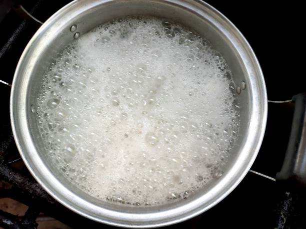 istock Cooking Rice Congee - food preparation. 1487061172