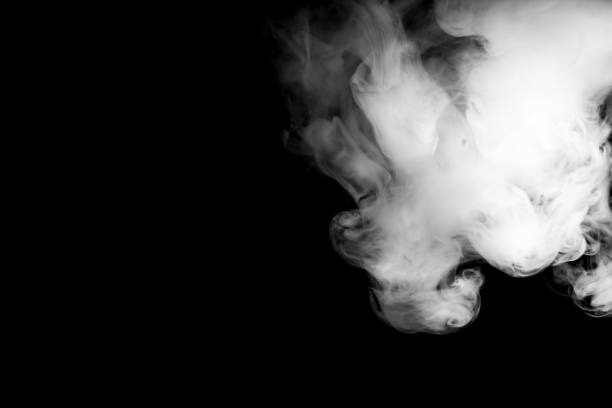 istock thick heavy white smoke on a completely black background. Copy space at left side; great for overlay design; shallow dof; selective focus 1487062454