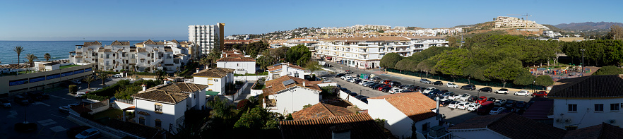 2023.04.08 - Cala de Mijas, Andalusia, Spain - cityscape and sea shore in a distance - panorama