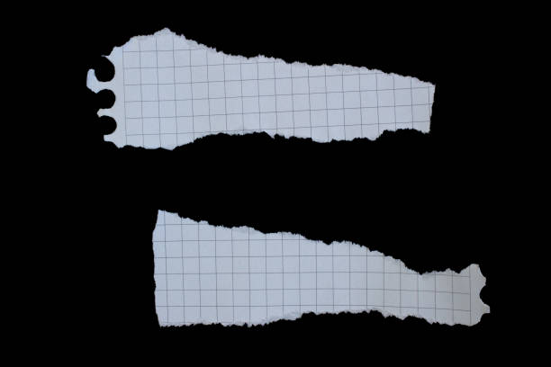 istock Ripped paper piece isolated on a black background 1487065771