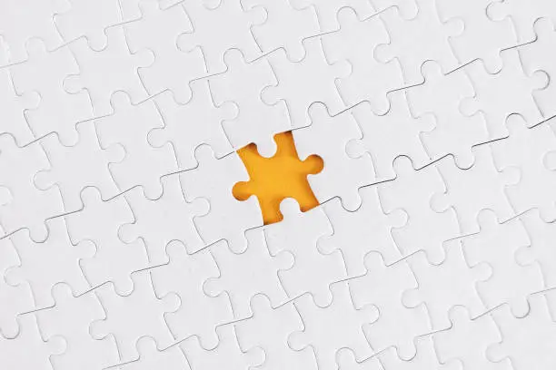 The Missing Piece.A jigsaw puzzle with a gap where one piece is missing.