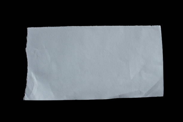 istock Ripped paper piece isolated on a black background 1487067354