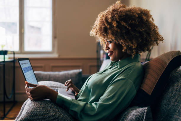 istock A Happy Beautiful Businesswoman Working From Home On Her Computer 1487069581